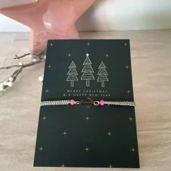 Weihnachtskarten|UtosaDesign Filigran geknüpftes Armband in Grau mit Anker-Element in Silber, Glasschliffperlen in Rosa, Weihnachtskarte