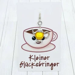 Outlet Glücksbringer Kanne silberfarben/gelb – Charm für Heißgetränkeliebhaber & Geschenk Geschenke