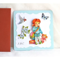 Glückwunschkarten|Geschenke und Keramik Glückwunschkarte zum Schulanfang Mädchen mit Puppe hellblau-rostrot (5)