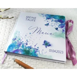 Online personalisiertes Gästebuch & Album zur Taufe mit Schmetterling & Blume in Türkis / Lila blanko o. mit Fragen Fotoalbum & Gästebuch